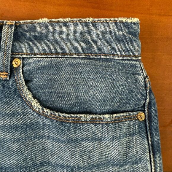 Good American Step Hem Jean Denim Mini Skirt. Distressed Medium Wash. Size 8/29. - Picture 9 of 10